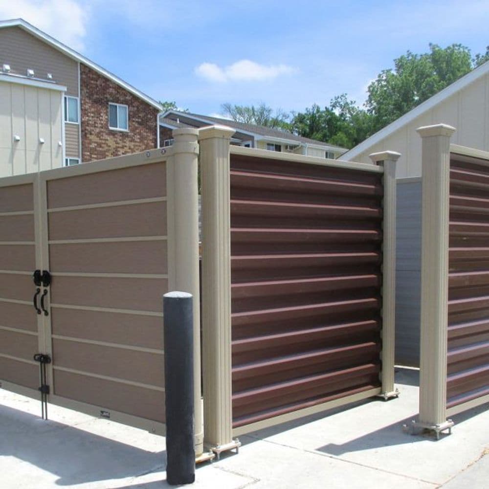 Modern wooden fence with contrasting colors in a residential area.